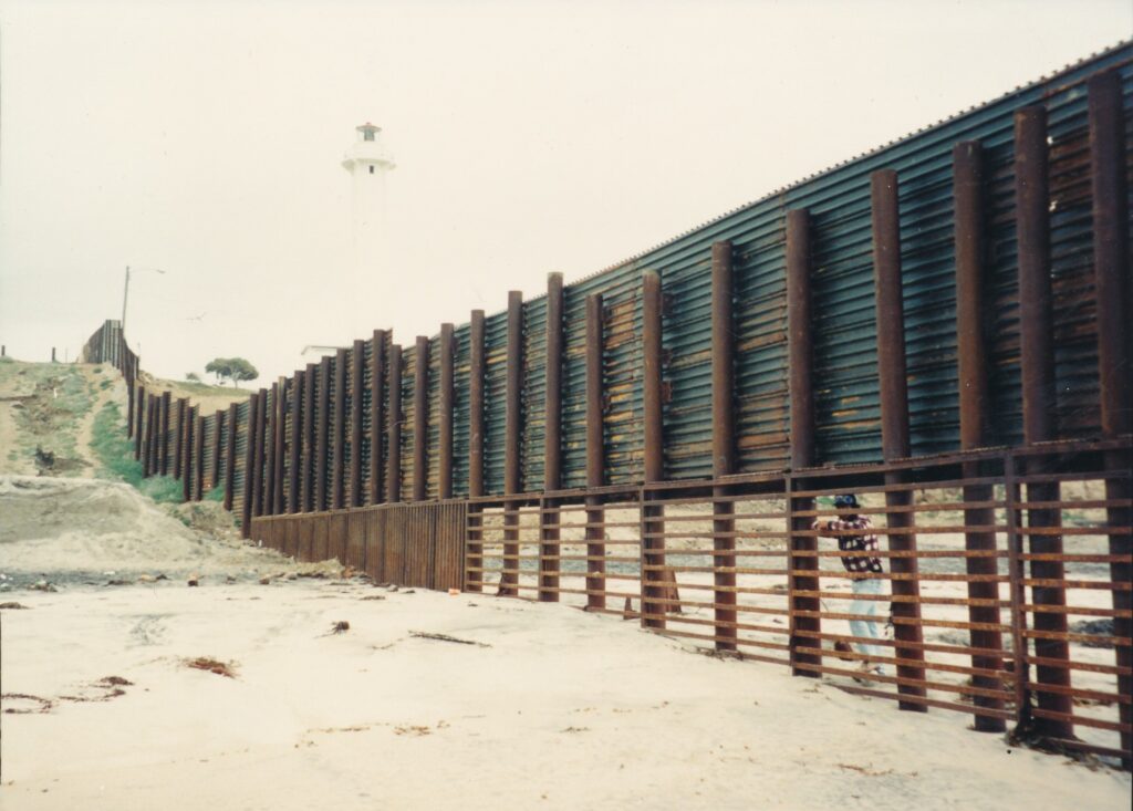 There's something cold and depressing about this border fence that continues into the ocean.