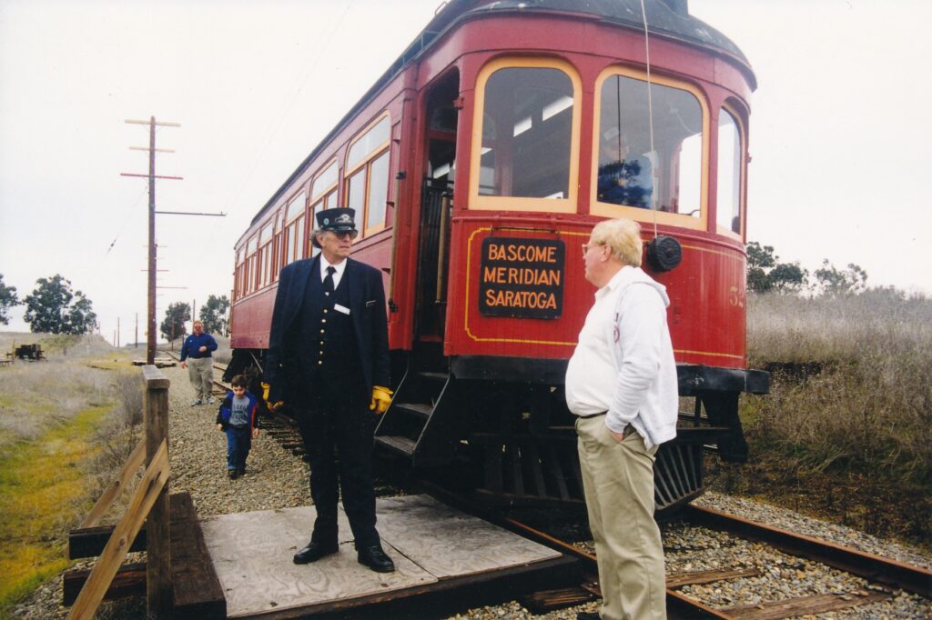 Motorman and guide Dennis Sloate talks with a patron/passenger at the Western Railway Museum.