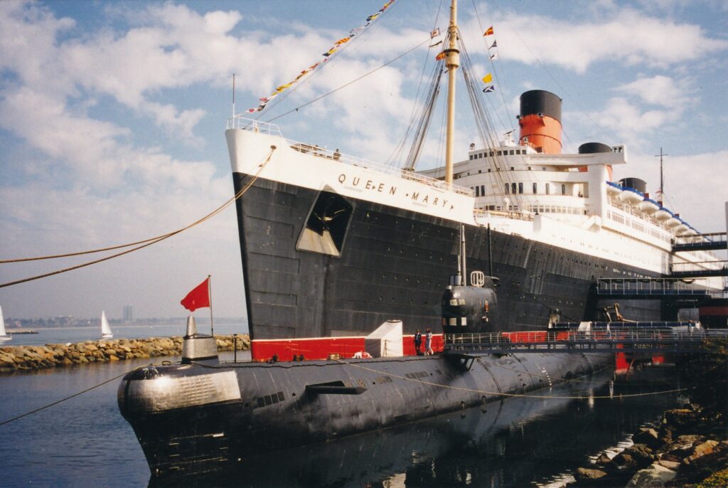 The decommissioned Soviet Scorpion submarine is docked next to the Queen Mary in Long Beach.